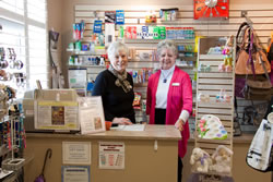 Two RVH Auxiliary women in the gift shop